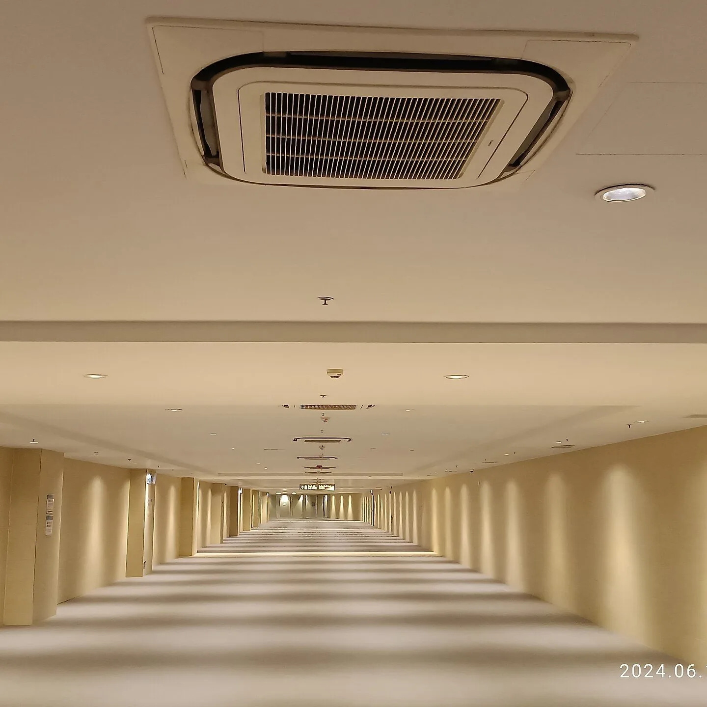 Ceiling cassette units spaced along a corridor ceiling